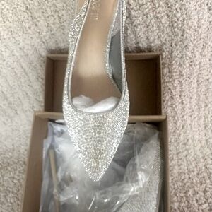 Stunning block heel silver rhinestone, sling back heels.  Never worn.  Size 8M.